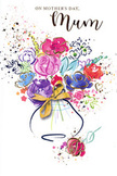 This artistic Mother's Day card presents a lively, watercolour bouquet that looks as though it has been painted in one inspired sitting, like a florist capturing the spirit of spring in Gipsy Hill. At the heart of the design, lush blooms in cerise, magenta and hot pink cluster together, their petals loosely outlined in dramatic indigo strokes that give them depth and definition. The colours bleed into one another in soft gradients, suggesting layers of velvety petals and the fullness of a hand-tied arrangement. Surrounding these central blossoms, patches of gentle lavender, pale blue, soft yellow and fresh green drift outward, evoking supporting flowers and foliage, much like the mixed plantings in local front gardens along Gipsy Road. Fine, glimmering gold details highlight the edges of petals and leaves, adding a sense of luxury and a subtle shimmer, reminiscent of sunlight grazing freshly delivered flowers. The bouquet rises from a simple, softly rounded vase, picked out in pale washes and decorated with an elegant golden bow, echoing the look of a carefully wrapped gift. Around the main arrangement, playful paint splatters and small heart shapes float against a clean white background, creating the feeling of petals thrown in celebration and emotions spilling beyond words. The overall impression is light, joyful and full of affection, like opening the door to a surprise Mother's Day delivery. This card captures both the artistry of a thoughtfully composed bouquet and the warmth of the bond between mother and child, ideal for mums across Gipsy Hill who appreciate beauty, creativity and heartfelt gestures.